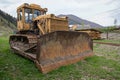 Old yellow bulldozer in the highlands Royalty Free Stock Photo