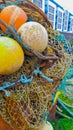 Old yellow buoys in a net Royalty Free Stock Photo