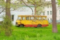 Old yellow bus. Old non-working bus side view. Yellow bus with rust. Royalty Free Stock Photo