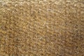 Old yellow fleecy hemp carpet. rough surface texture Royalty Free Stock Photo