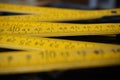 Old yellow folding meter ruler measuring centimeters Royalty Free Stock Photo