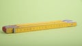 old yellow folding rule with centimeter measurement Royalty Free Stock Photo