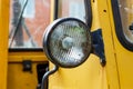 Old yellow forklift truck front headlight closeup Royalty Free Stock Photo