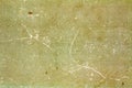 Old yellow-green paper texture with scratches and stains. Abstract background Royalty Free Stock Photo
