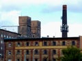 Abandoned old brick factory building elevation with smoke stack Royalty Free Stock Photo