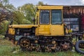 An old yellow rusted crawler tractor Royalty Free Stock Photo