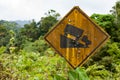 Old yellow rusted steep grade hill traffic sign.