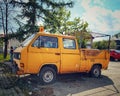 Old yellow rusty truck car Volkswagen Transporter T3 with double cabin parked