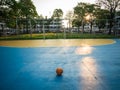 Old yellow soccer ball on the blue football field Royalty Free Stock Photo