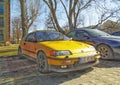 Old yellow sport car Honda Civic parked.