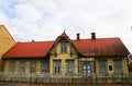 Old yellow village wooden house exterior in old town