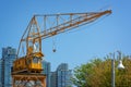 Old yellow vintage industrial loading crane on Granville Island, Vancouver, British Columbia Canada