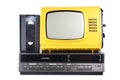 Old yellow vintage TV with videotape stands on a VCR from the 1980s, 1990s, 2000s, isolated on a white background. Royalty Free Stock Photo