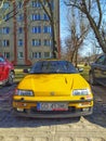 Old yellow sport car Honda Civic parked.