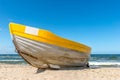 A yellow boat on the beach Royalty Free Stock Photo