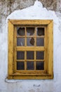 Old yellow wooden window with broken glass Royalty Free Stock Photo