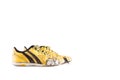 Old yellow worn out futsal sports shoes on white background soccer sportware object isolated Royalty Free Stock Photo