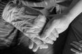 Old and young hands check hand black and white Royalty Free Stock Photo