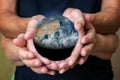 old and young person hands holding planet earth, unity concept. elements of this images furnished by nasa