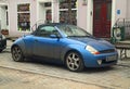 Old veteran or youngtimer private small compact cabrio car Ford KA rare model parked