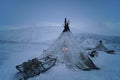 Old yurt of Siberia and sledge, cloudy day.