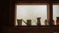 An old zinc watering can in the summer garden. antique weathered blue wooden peeled off background with iron watering can