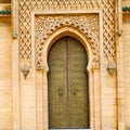 olddoor in morocco ancien and wall ornate brown Royalty Free Stock Photo