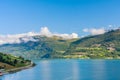 Olden, Norway, typical summer panorama of Norwegian village landscape, mountains and colorful traditional nordic houses