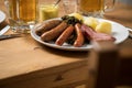 Oldenburger green cabbage with sausage mix, Kassler pork neck, boiled potatoes, mustard, beer and grain liquor is an traditional Royalty Free Stock Photo