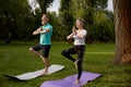 Older active couple doing yoga exercise outdoors at city park Royalty Free Stock Photo