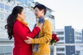 Older asian couple on balcony with gift Royalty Free Stock Photo
