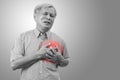 Older asian man clutching and having chest pain cause from heart attack. Royalty Free Stock Photo