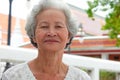 Older Asian women with grayish hair have smiling faces