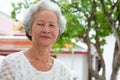 Older Asian women with grayish hair have smiling