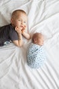 The older brother touches his little brother. Royalty Free Stock Photo