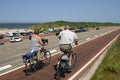 Older couple cycling on Brouwersdam, Netherlands