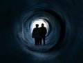 Older couple in front of white light tunnel end Royalty Free Stock Photo