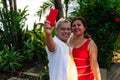 Older couple having their picture taken in the park