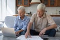 Older couple manage family budget, pay bills, sorting out papers Royalty Free Stock Photo