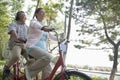 Older couple riding tandem bicycle, Beijing Royalty Free Stock Photo