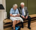 Older couple uses tablet for information at Chicago Art Institute