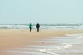 Older couple walking at the beach
