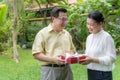 Older couples give gifts to show love Royalty Free Stock Photo