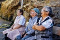 Older Galician people dedicated to work in the field talking happily in the province of Orense, Galicia. Spain.