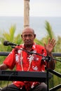 Older gentleman playing music for guests at dinner, Wananavu Beach Resort,Fiji,2015