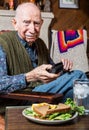 Older Gentleman with Sandwich