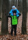 Older hold younger brother on his shoulders Royalty Free Stock Photo