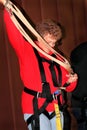 Older Lady Inspecting Zipline Gear Royalty Free Stock Photo
