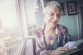 Older lady looking through photographs Royalty Free Stock Photo