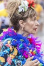 2018: Older lady wearing colorful feathers attending Gay Pride parade also known as Christopher Street Day CSD in Munich